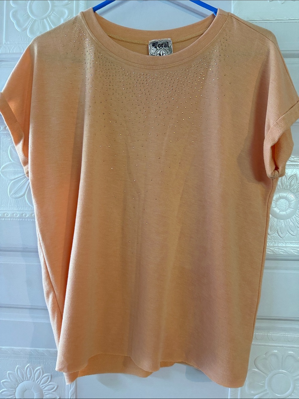 Light sweater by Vocal, accented with sparkles. Size small.